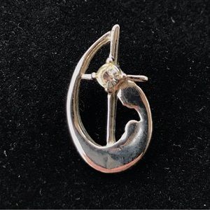 Silver tone Mary Madonna and Jesus child pin with cross and rhinestone